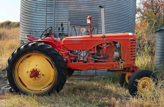 Retired tractor and grain silos on the Waterville Plateau