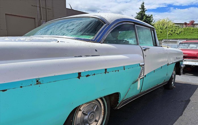 Old car at a mom and pop car dealershop in Wenatchee WA